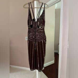 Headed cocktail dress with cut outs